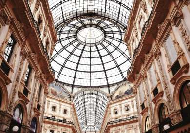 Brown and tan building with a glass dome roof.