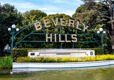 Beverly Hills sign behind a river.