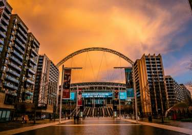 Wembley stadium at sunset.