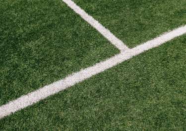 Edge of football pitch .