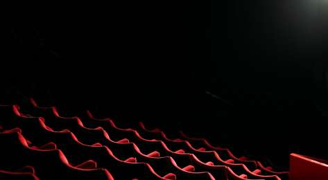 Red seating in theatre.
