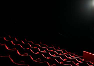 Red seating in theatre.