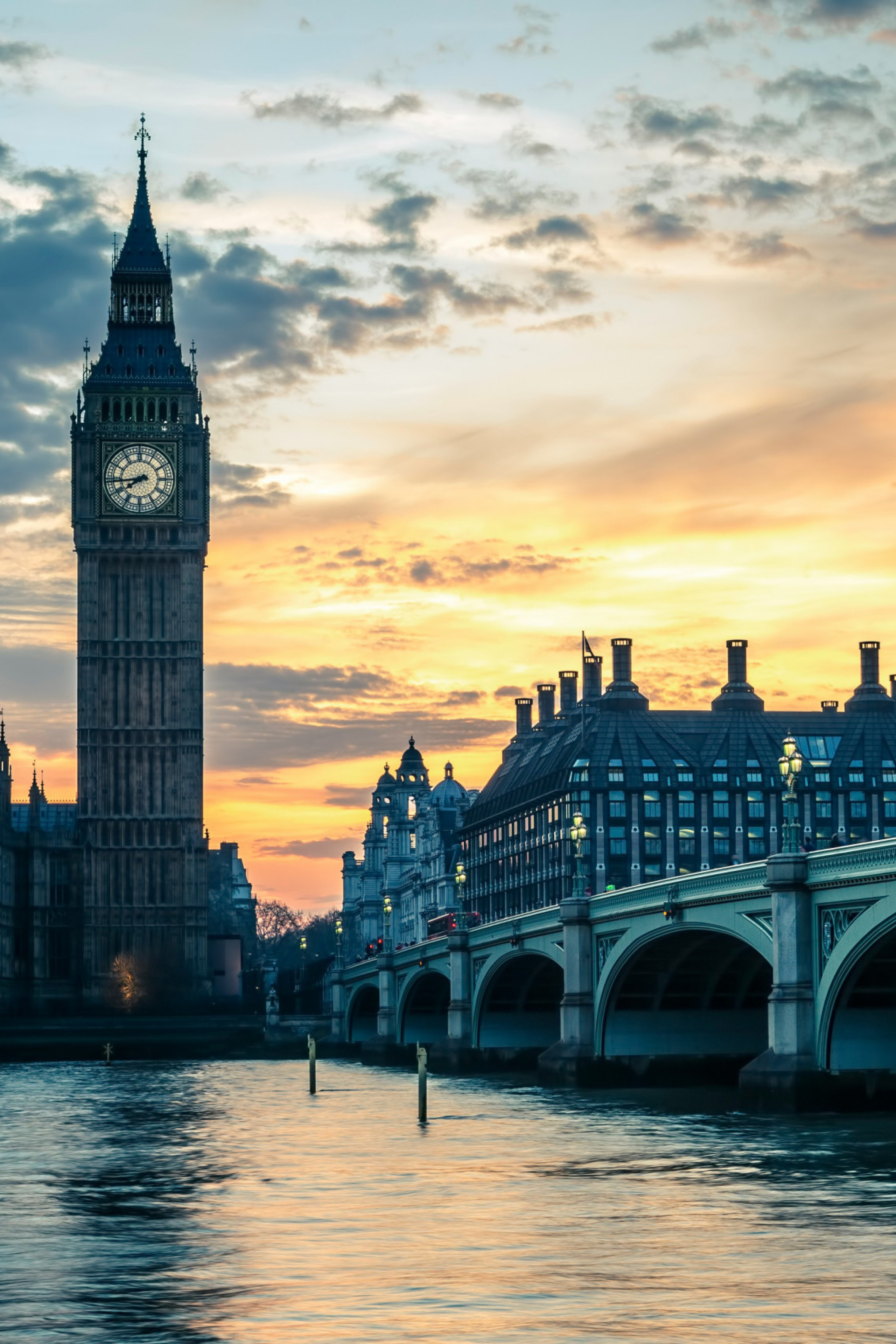 Westminster London during sunset behind the Thames