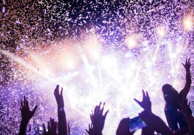 Purple back-lit concert confetti image.