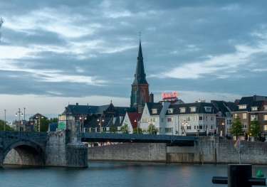 City of Maastricht with a bridge and river in front.