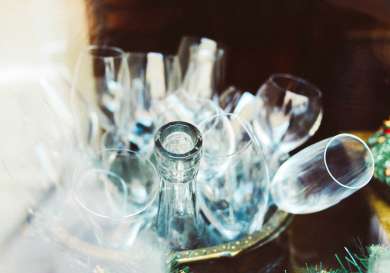 Collection of glasses in bucket .