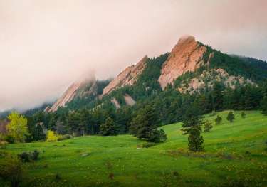 Fog over a mountain range in Boulder, Colorado.