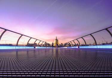 View of st paul's cathedral across bridge in london.