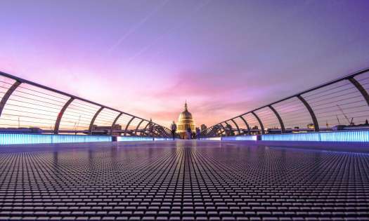 View of st paul's cathedral across bridge in london.