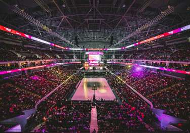 Packed basketball arena.