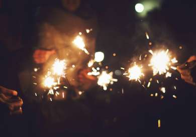 New Years Eve celebration with hand-held sparklers.