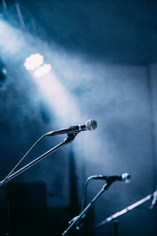 Three microphones on stage.
