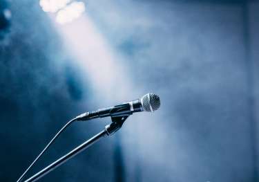 Three microphones on stage.