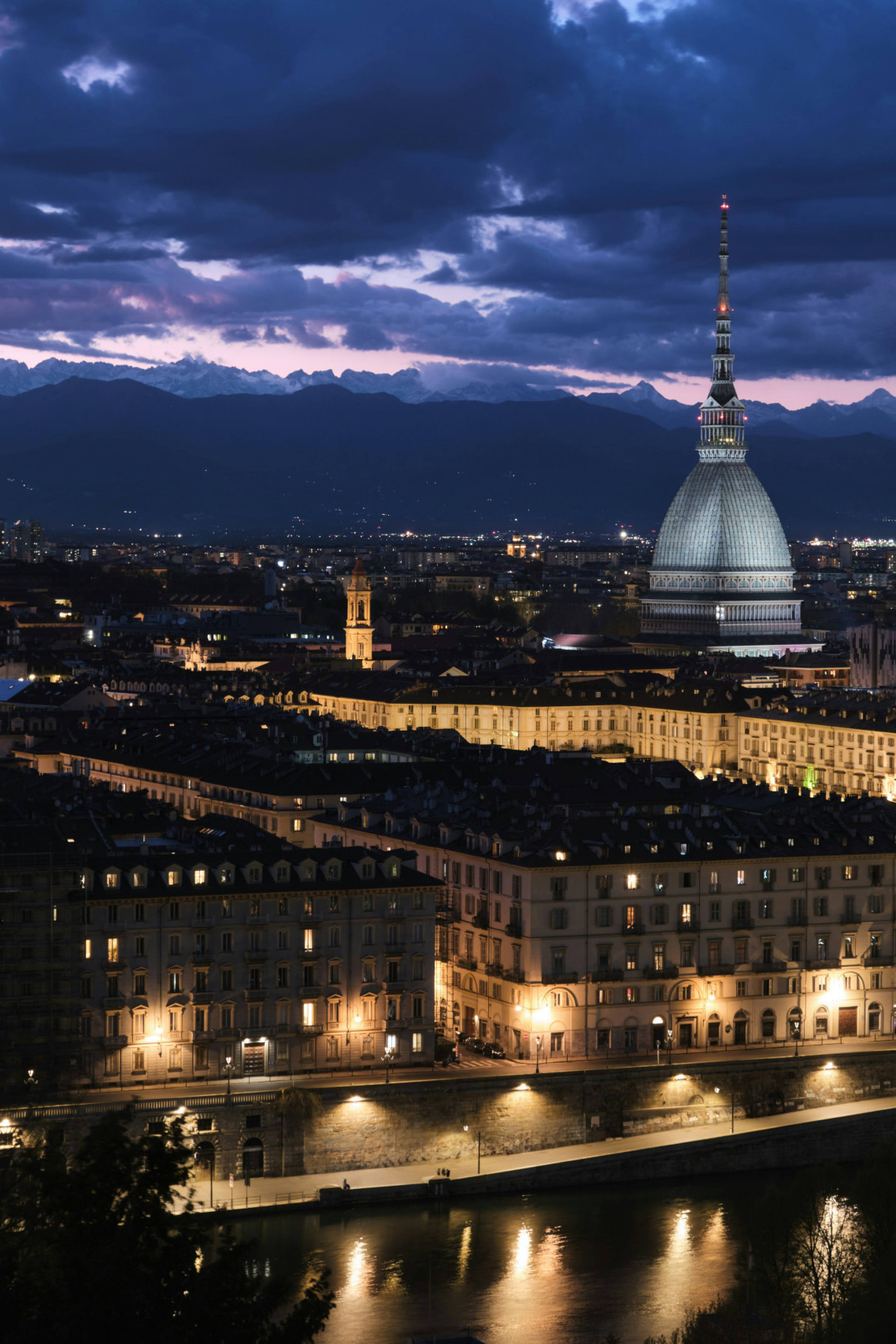 Torino, Italy lit up at dusk