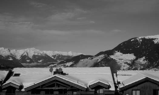 Black and white image of a snowy town: Courchevel, France.