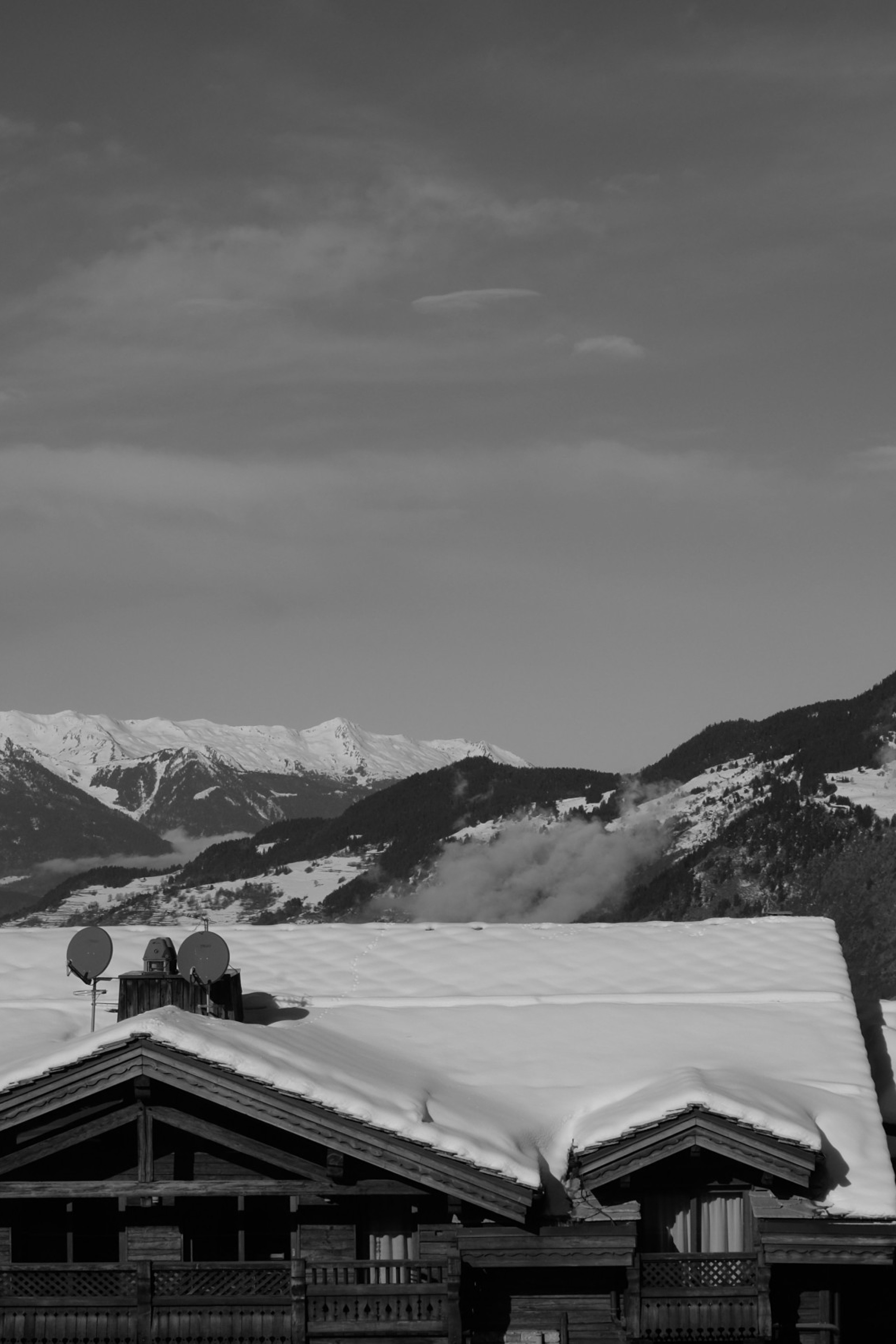 Black and white image of a snowy town: Courchevel, France