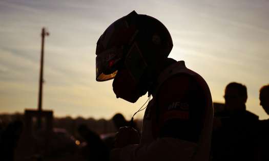 Silhouette of racing driver.