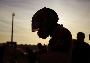 Silhouette of racing driver.