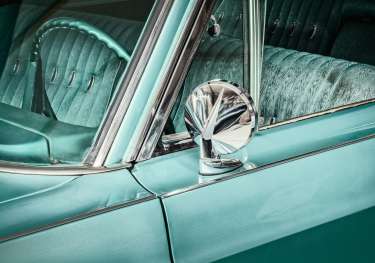 Mint green vintage car exterior .