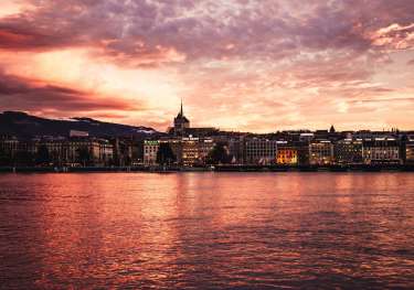 Geneva city and sea during golden hour.