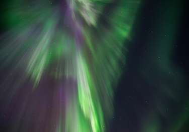 Photo of night sky with northern lights .