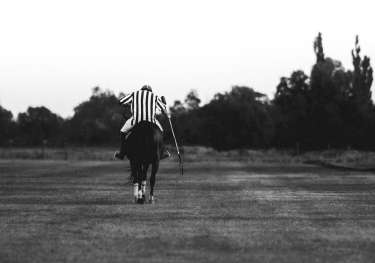Person playing polo.