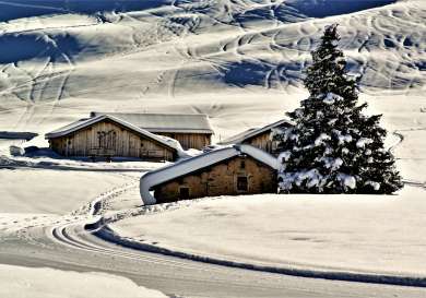 Snowed-over houses in Courchevel, France.