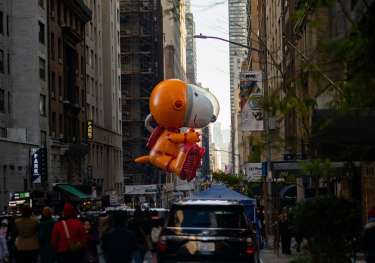 Astronaut Snoopy character balloon in parade.