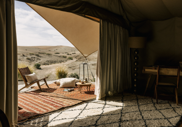 Luxurious tent with desert view.