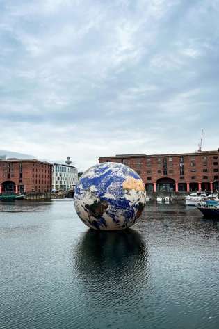 Eurovision Song Contest Floating Earth on a body of water in Liverpool.