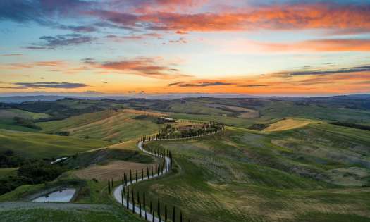 Sunset over tuscan hills .