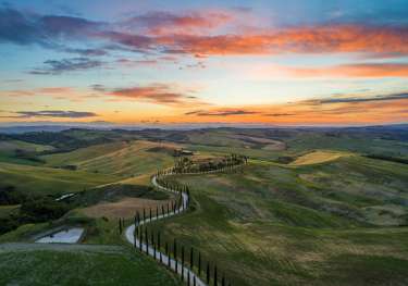 Sunset over tuscan hills .