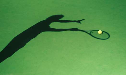 Shadow of tennis player.