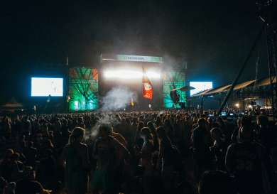 Austin City Limit's Honda stage lit up at night with a crowd in front.