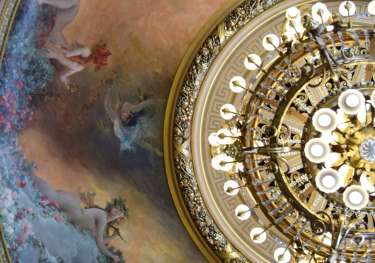 Photo of painting on ceiling with chandelier.