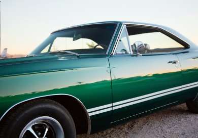 Vintage bottle green car.