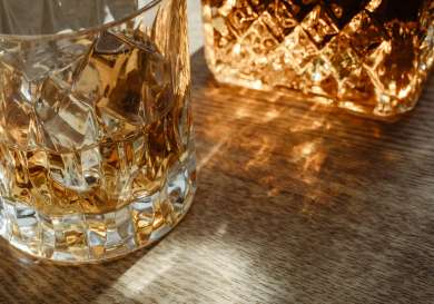 Close-up of scottish whisky glass and bottle.