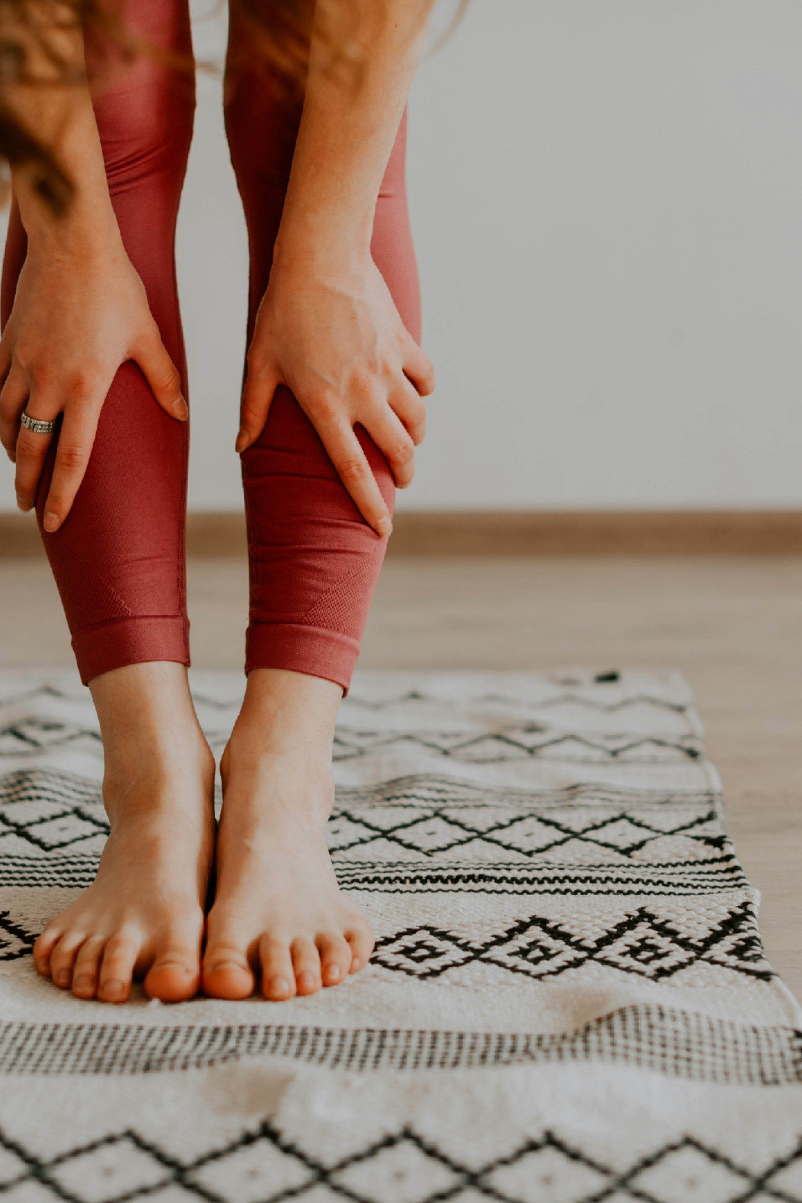 woman stretching on mat