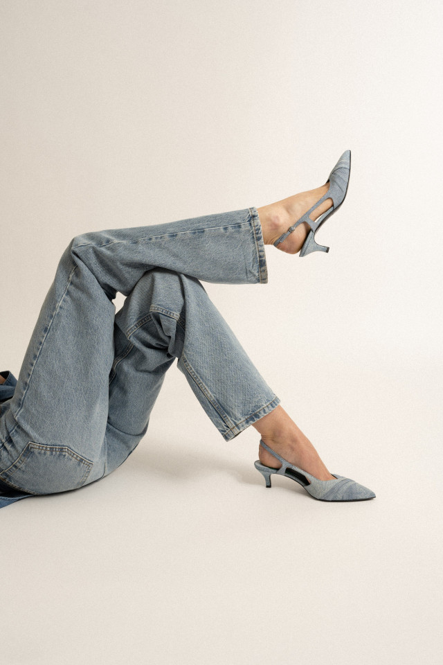 model wearing slingback denim heels
