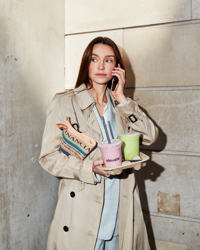 founder julia baldet holding tray of smoothies
