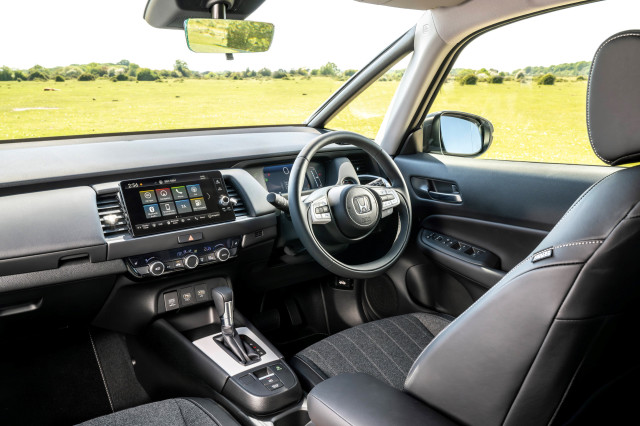 interior of honda jazz hybrid showing dashboard and wheel 
