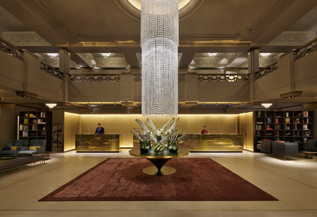 hotel lobby with large crystal chandelier 