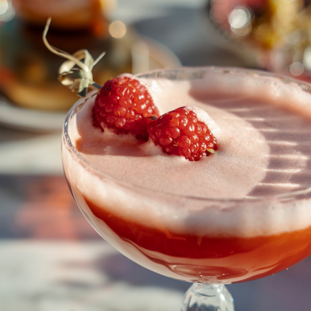 cocktail with fresh raspberries
