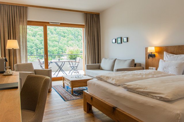 hotel bedroom with adjoining living space