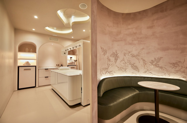 treatment room with green sofa outside