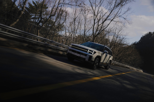 hyundai santa fe hybrid car being driven on the road 