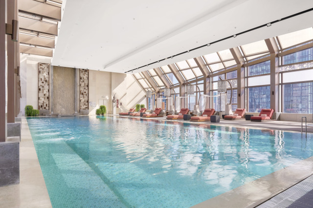 indoor luxurious swimming pool with skyline views 