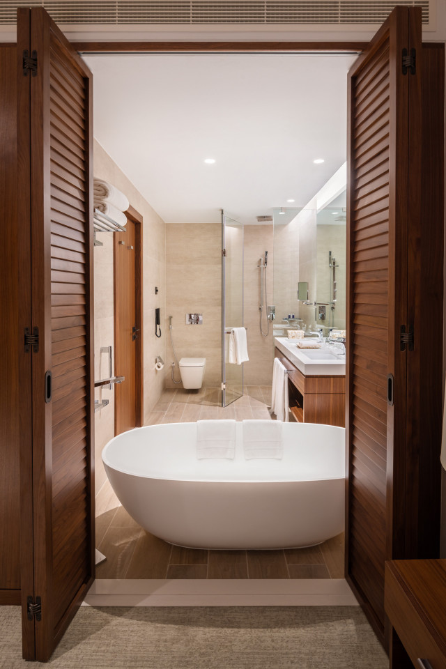 photo of bathtub in hotel bathroom