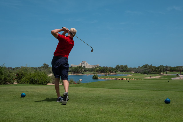 photo of man playing golf at Dubai hotel