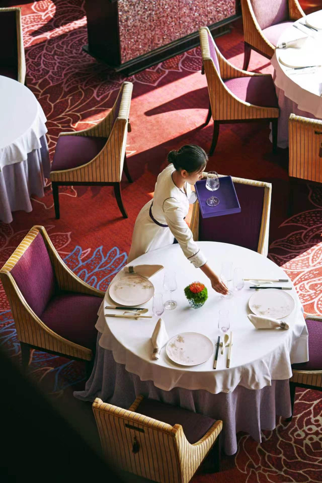 aerial view of hotel restaurant table with four chairs